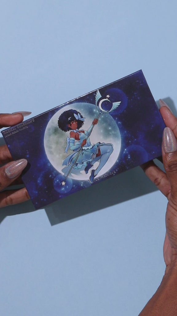 open magical guardian 8 pan duochrome lunar palette, swatches of blue duochrome eyeshadow, sparkly colorshifting arm swatches of the magical guardian lunar palette. Sparkly duochrome swatches on dark skin. 